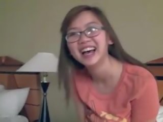 Beautiful Busty Asian young woman Fngers In Glasses