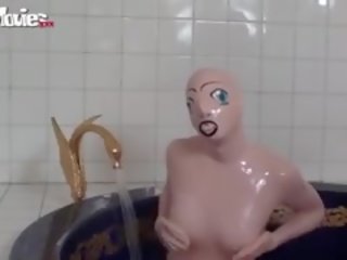 Tanja Takes A Bath In Her Latex adult film Doll Costume