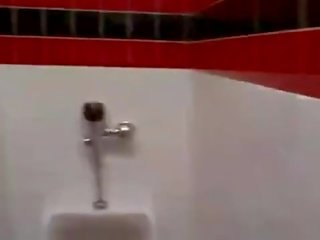 Cashier gives a random youth a public bathroom blowjob