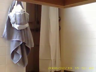 Spying enchanting 19 year old lady showering in dorm bathroom