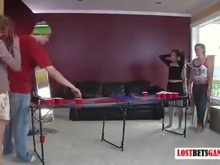 Three Girls and One juvenile Play a Game of Strip Beer Pong